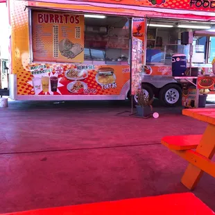 a mexican food truck parked in a parking lot