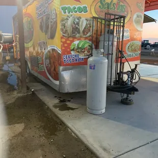 a food truck parked at a gas station