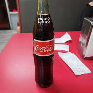 a coke bottle on a table