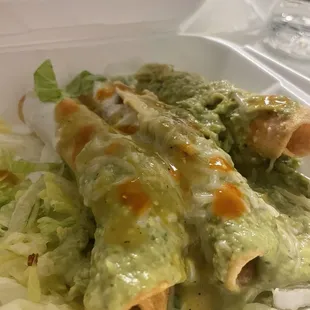 rolled tacos w lettuce, guac and sour cream