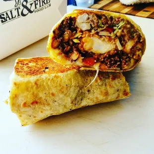 owner&apos;s photo of crispy shrimp &amp; chorizo burrito w/chorizo fried rice, cabbage, lime, beans, cheese, avocado cream