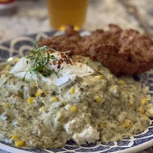 Chicken Friend Chicken with poached eggs and sausage jalapeño gravy. Yummy.