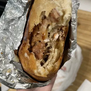 Super burrito with 1/2 carnitas and 1/2 carne asada