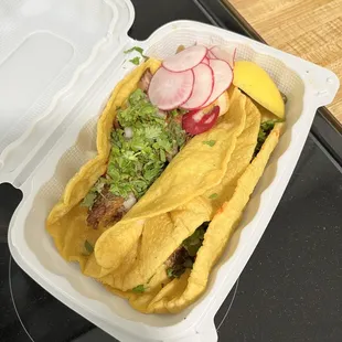 2 carnitas tacos. Grilled onions &amp; jalapeño underneath.