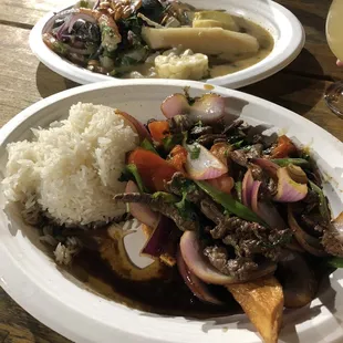 Lomo Saltado (bottom) &amp; Ceviche Mixto (upper)