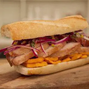 Pan con chicharrón ) pork sweet potato citrus onions