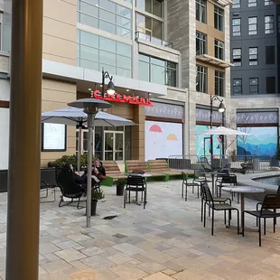 Outdoor tables and chairs next to Salt and Straw