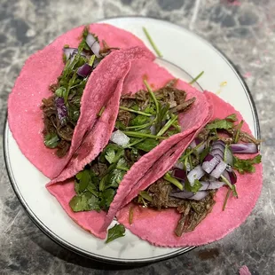 two beef tacos on a plate