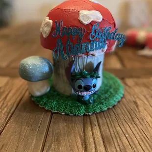a mushroom house with a happy birthday message