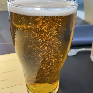a glass of beer on a table