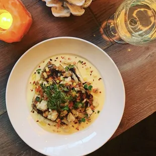 a plate of food on a wooden table