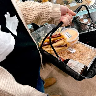 a woman holding a tray of food