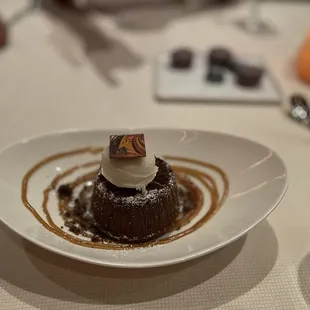 a dessert on a white plate on a table