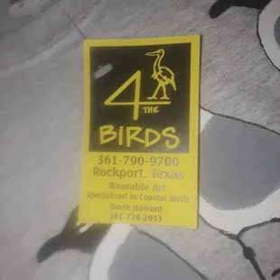 Wearable art, the artist paints birds on various types of shirts.