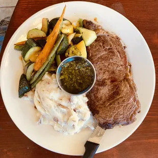 My Daughter ordered the steak. Yummy Chimichurri sauce. Mashed potatoes and veggies were so good