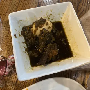 a plate of food and a glass of wine