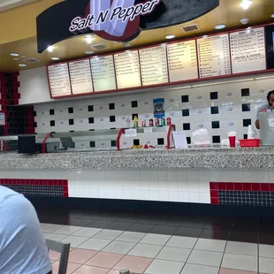 a man sitting at a table in a restaurant