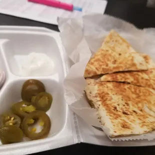 Chicken quesadilla with jalapeno, sour cream and salsa