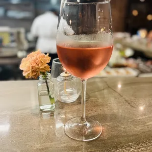 a glass of rose wine