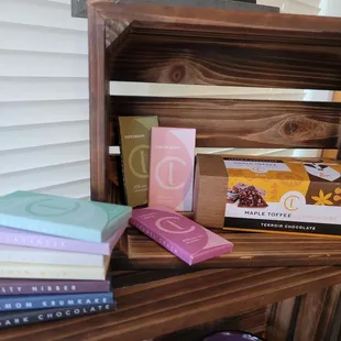 a stack of books on a wooden shelf