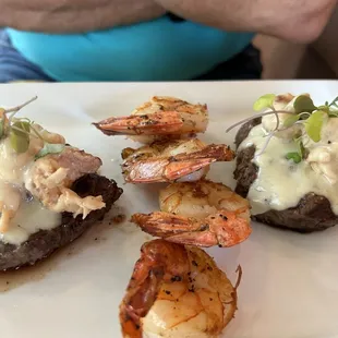 Filet medallions with lobster on top and four shrimps