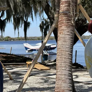 a man standing next to a boat