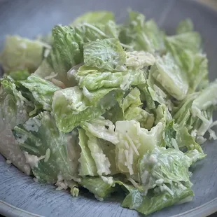 Delicious Caesar salad (shown without croutons) pairs well with the seafood!