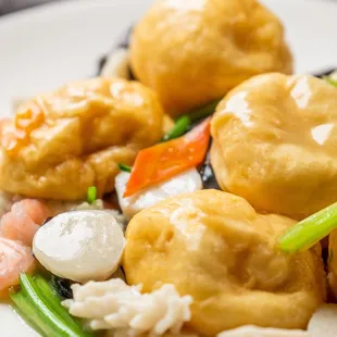 a plate of food with shrimp and vegetables