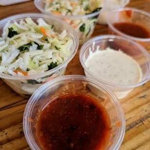 Slaw (included with plates). Cocktail and tartar sauces. I think the sauces are made in-house. They were really good.