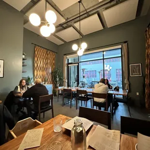 people sitting at a table in a restaurant