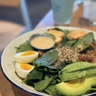 Fancy Farmer Bowl (Quinoa, spinach, 6-minute egg, bruleed goat cheese, red bell peppers, avocado, pear vinaigrette)