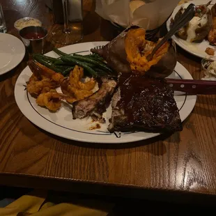 This is the baby back ribs/ shrimp combo, with baked sweet potato and string beans. Also honey rolls