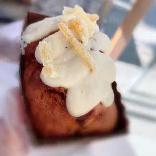 Gingerbread with seasonal fruit; topped with icing and candies ginger.