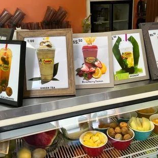 a variety of drinks displayed in a display case