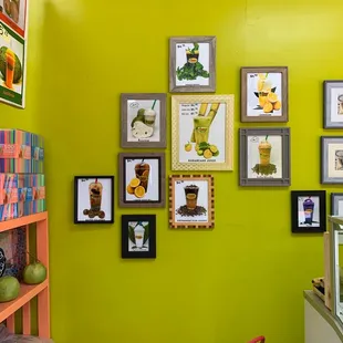 a bright green wall with pictures on it