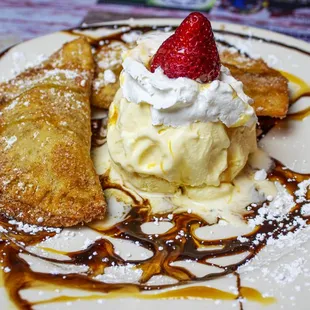 a dessert with ice cream and strawberries