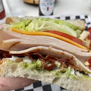 Look at those layers on this Salty Nun Turkey Club!