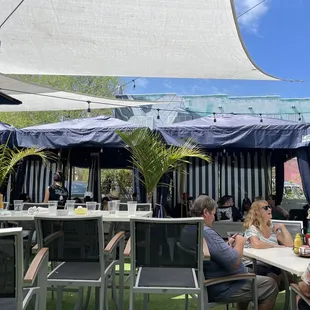 Huge outside patio with lots of shade and cabana seating. Also an outside bar (not shown)