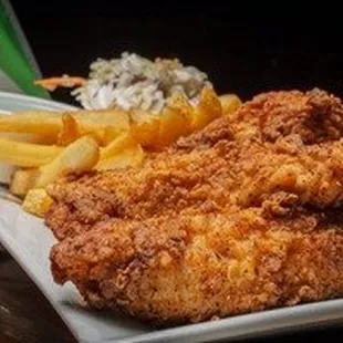Our hand breaded chicken tenders with fries and coleslaw