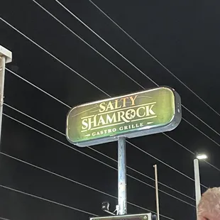 a man standing in front of a sign