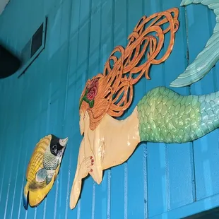 a mermaid&apos;s tail and fish