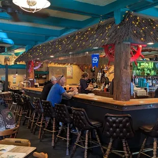 customers sitting at the bar