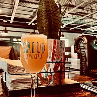 a glass of beer on a table