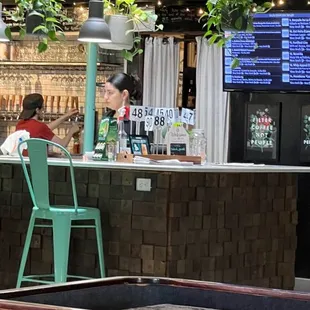 You order drinks and food at the bar and they bring the food to your table.