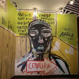 Going up stairs, art in hallway