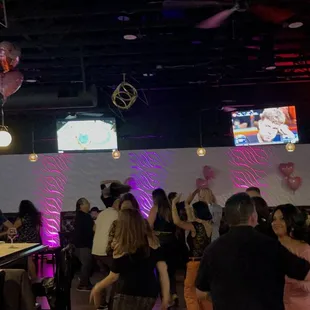 a crowd of people at a bar