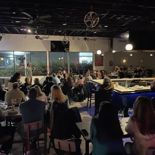 a large group of people sitting at tables