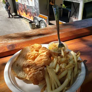 New to our menu, the shrimp po'boy! Yum, with fries of potato salad as a side and dripping in a specialty sauce and slaw.