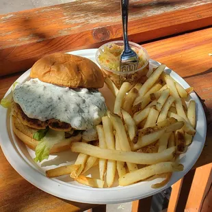 Our Mahi sandwich comes with a side of fries or potato salad and a special sauce.
