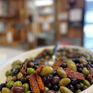 a bowl of olives and sun dried tomatoes